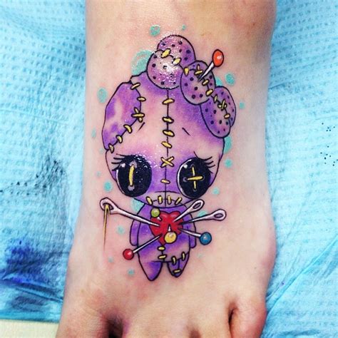 Understanding the Significance of Colors in Voodoo Doll Tattoos